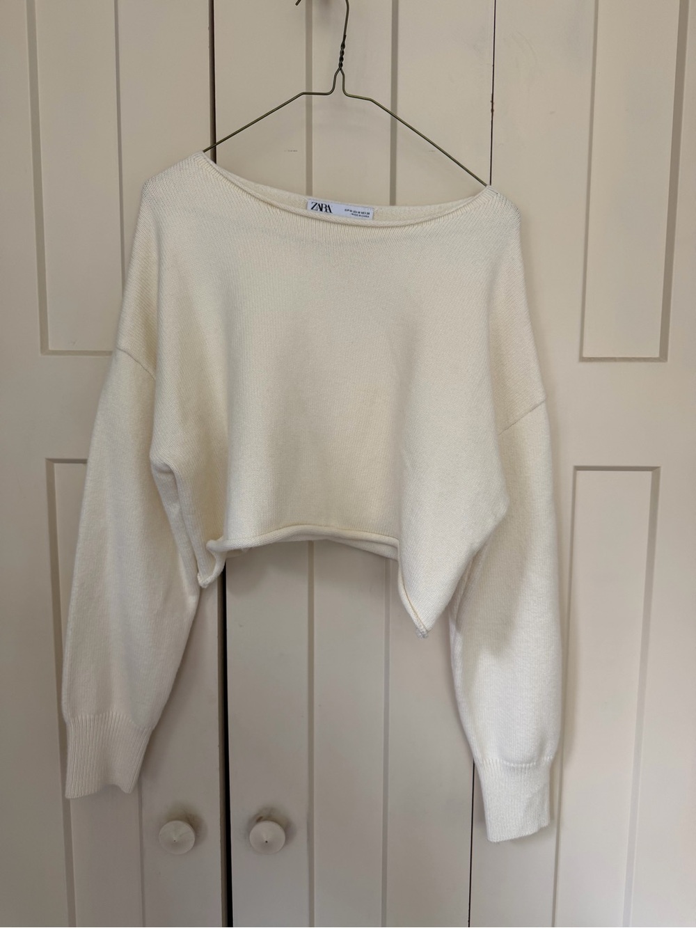 Zara Off-the-Shoulder Cropped Knit Sweater in Cream